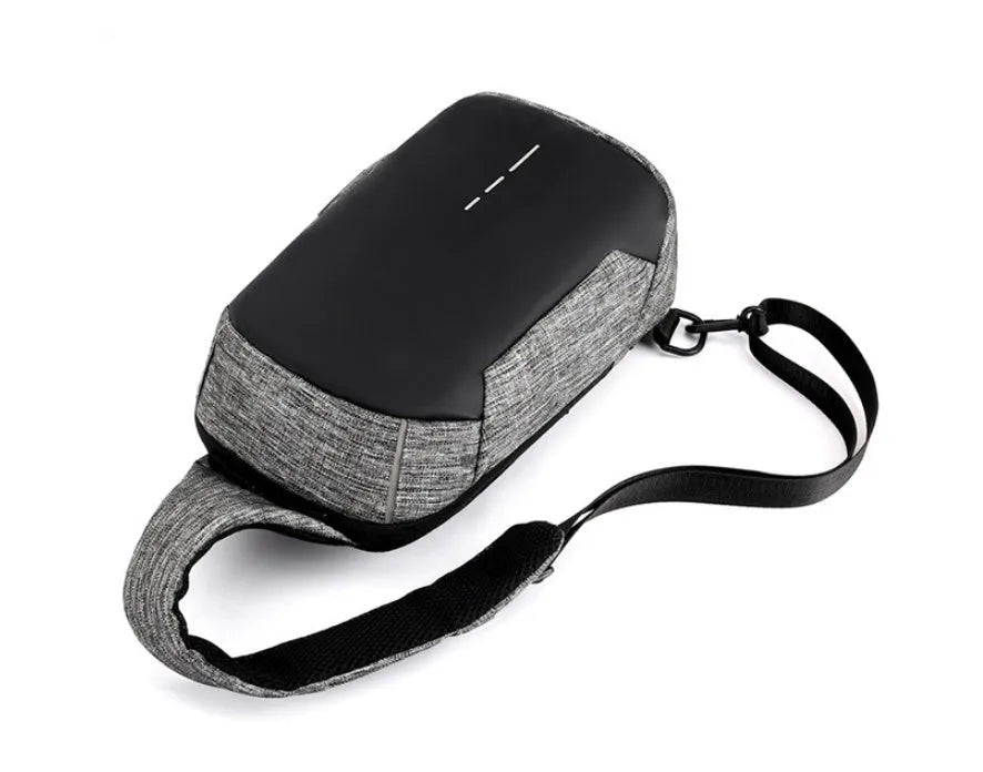 Dark blue Oxford cloth chest bag with a zipper and adjustable strap, shown from the front.