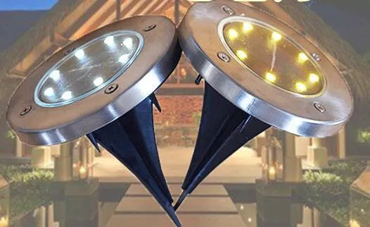 8LED waterproof solar garden light with IP65 protection and warm LED glow on lawn
