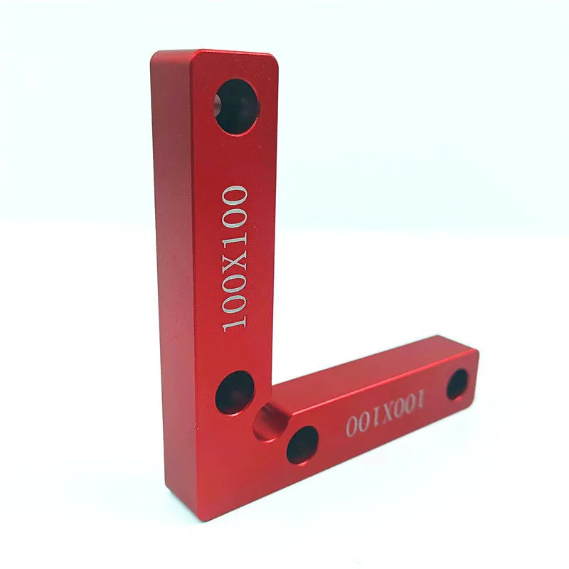 Machined aluminium right angle positioning block with measurement scales for woodworking jigs.