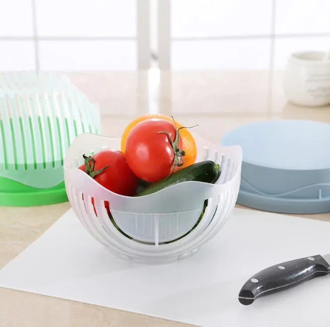 Blue salad cutter bowl with chopper lid and serving plate base for vegetable preparation
