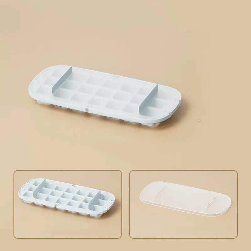 A high-capacity blue ice cube tray with a leverage-action lid and a stored ice shovel.