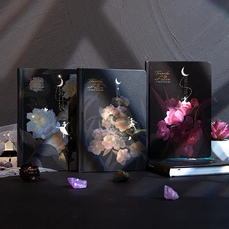 A5 notebook with luminous cover open to show pages filled with colour illustrations.