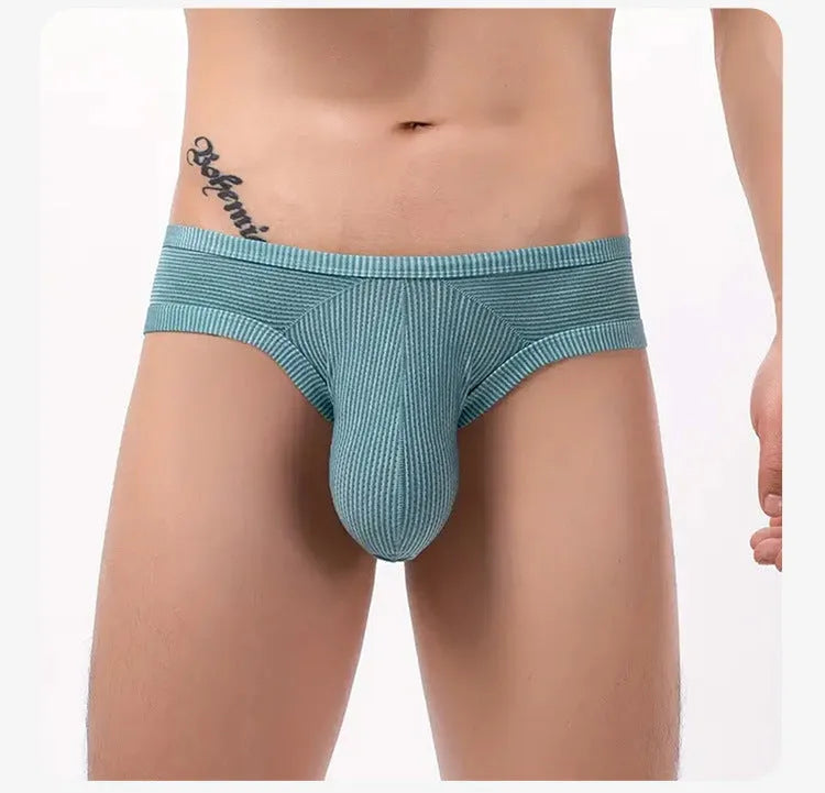 Men's low waist cotton briefs with hollow back design in red, black, blue, white, light green, grey red, or pink.