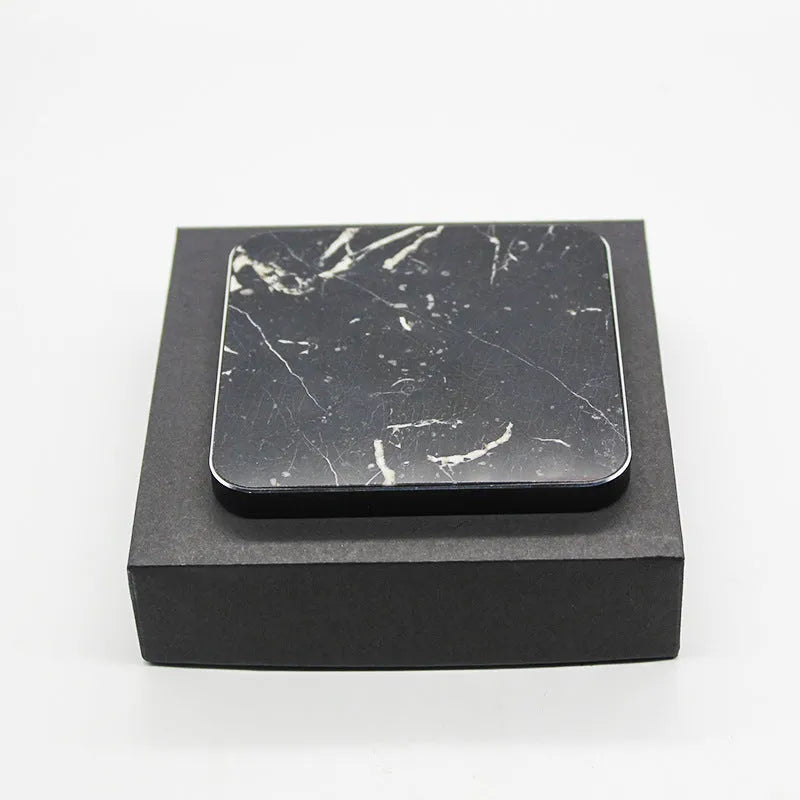 Real marble wireless charger with aluminium alloy base on desk showing indicator light