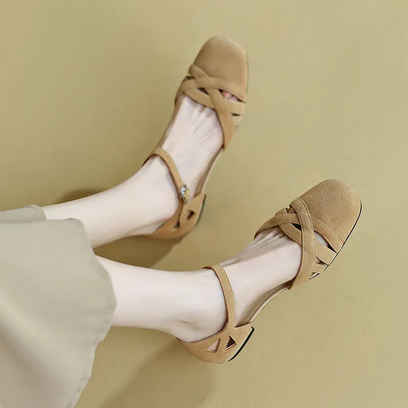 Women's Roman sandals with buckle closure in apricot colour showing round toe and shallow mouth design