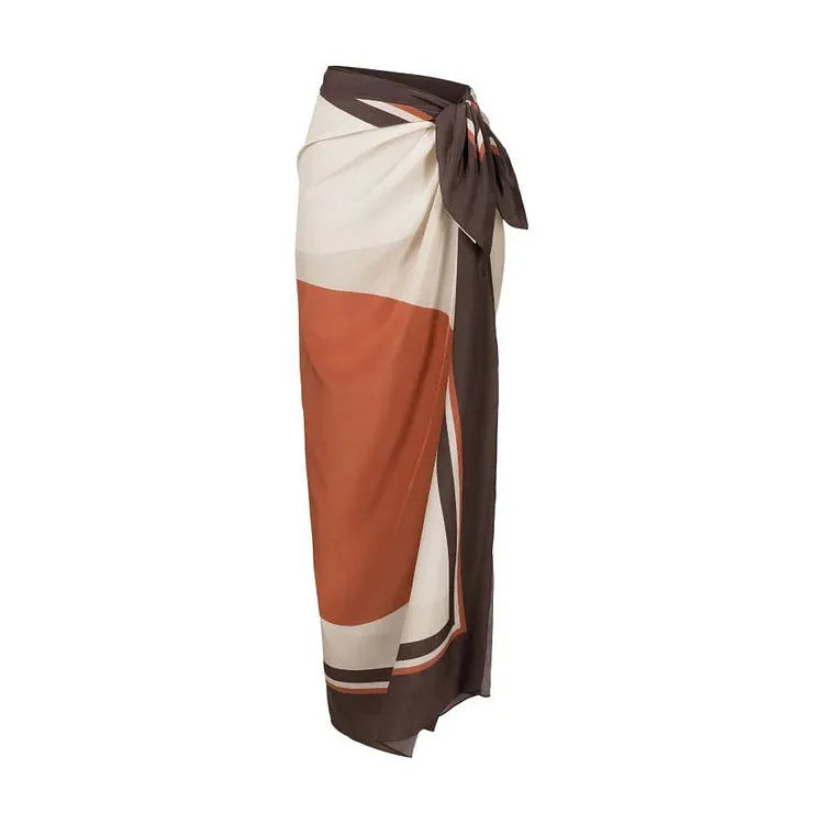 Women's printed dot one-piece swimsuit with a matching wrap skirt, shown on a mannequin.