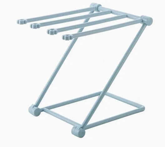 Foldable vertical dishcloth shelf in light blue with punch-free installation for kitchen organisation.