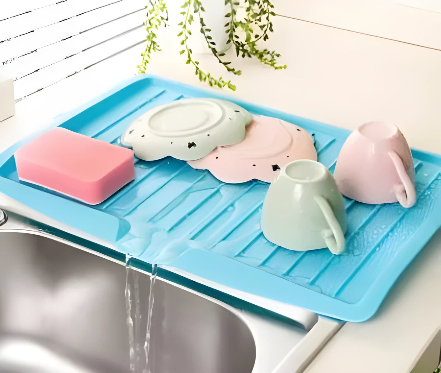 Kitchen dishes draining rack in blue, green, and white colour options on a countertop
