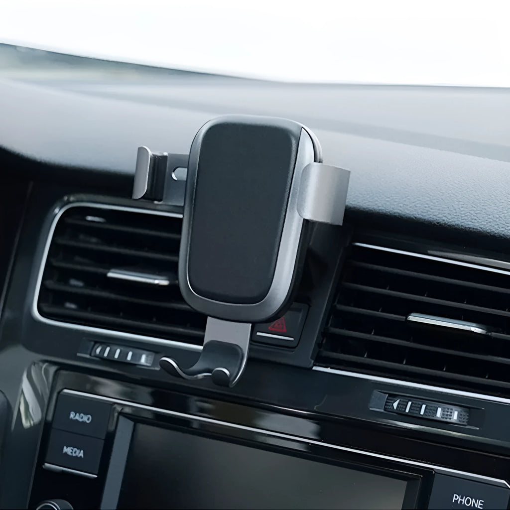 Black wireless car phone charger plugged into car dashboard with phone on charging pad, USB C port visible