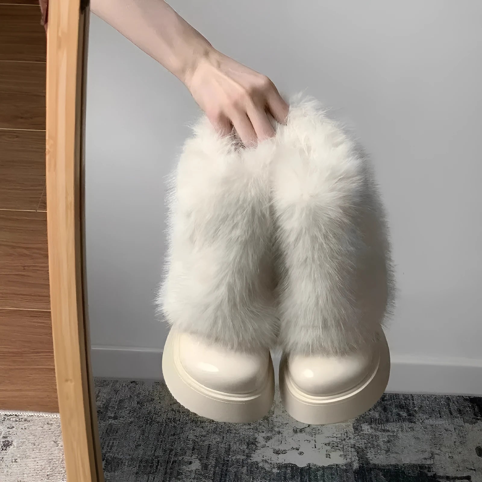 Women's black artificial plush snow boots with a waterproof rubber sole and fleece lining.