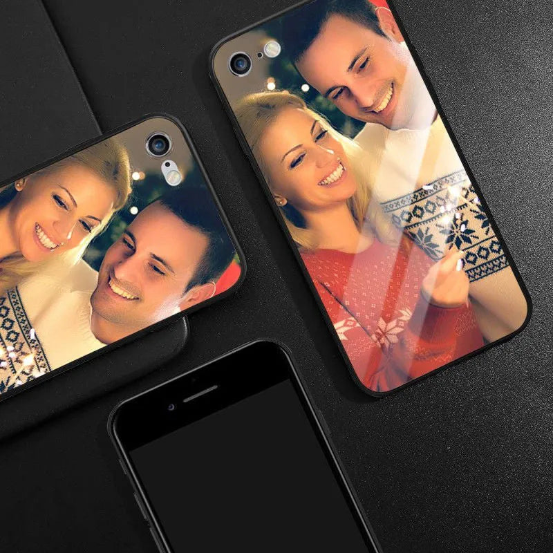 Slim patterned protective case for Apple iPhone with raised edges around screen and camera.
