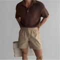 Men's cotton loose fit sports shorts in black, white, and khaki colours for summer athletic wear