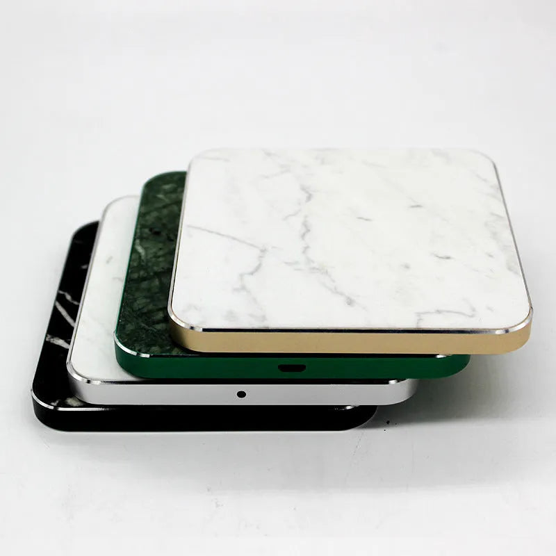 Real marble wireless charger with aluminium alloy base on desk showing indicator light