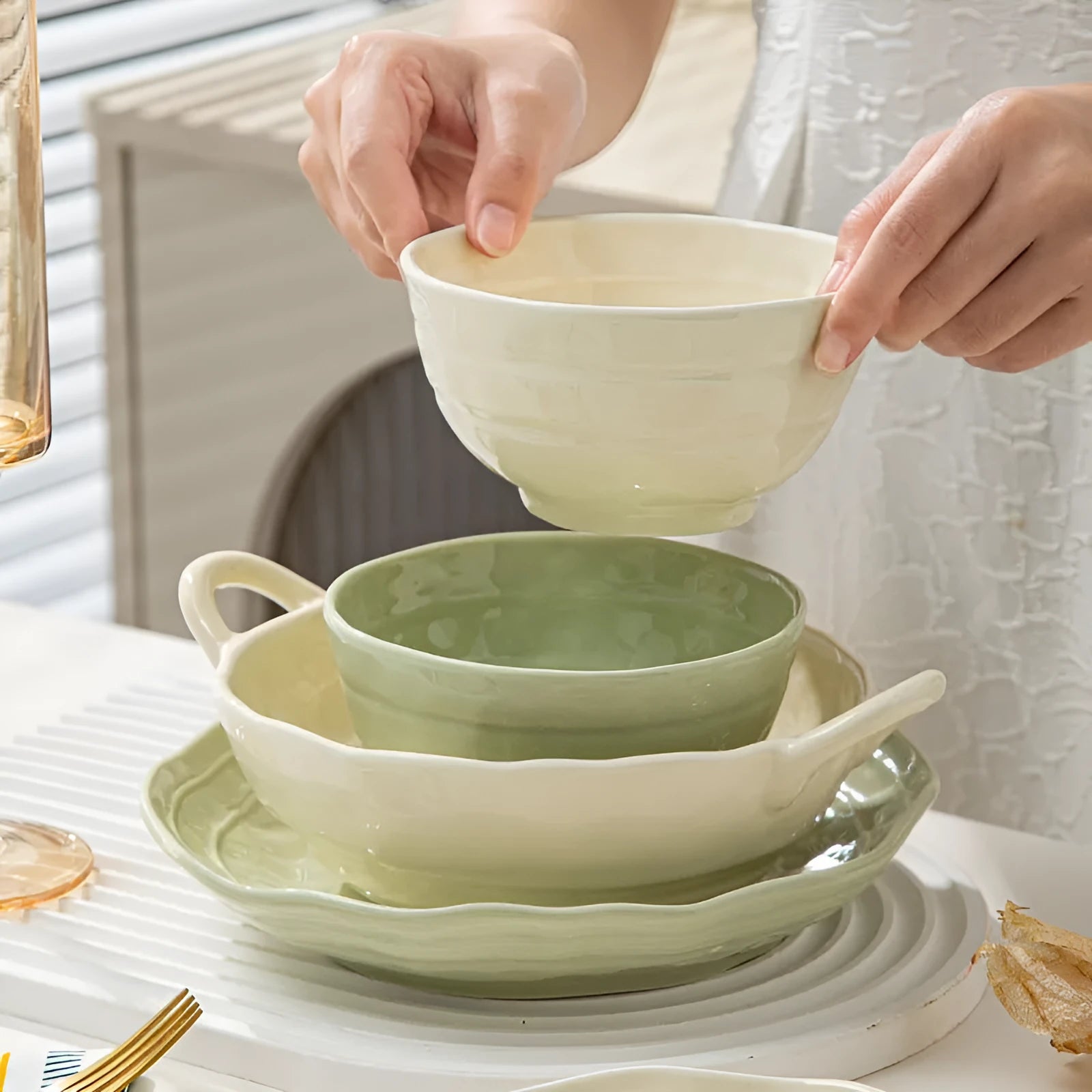 Solid colour ceramic dinnerware set with plates and bowls in modern Japanese minimalist style.