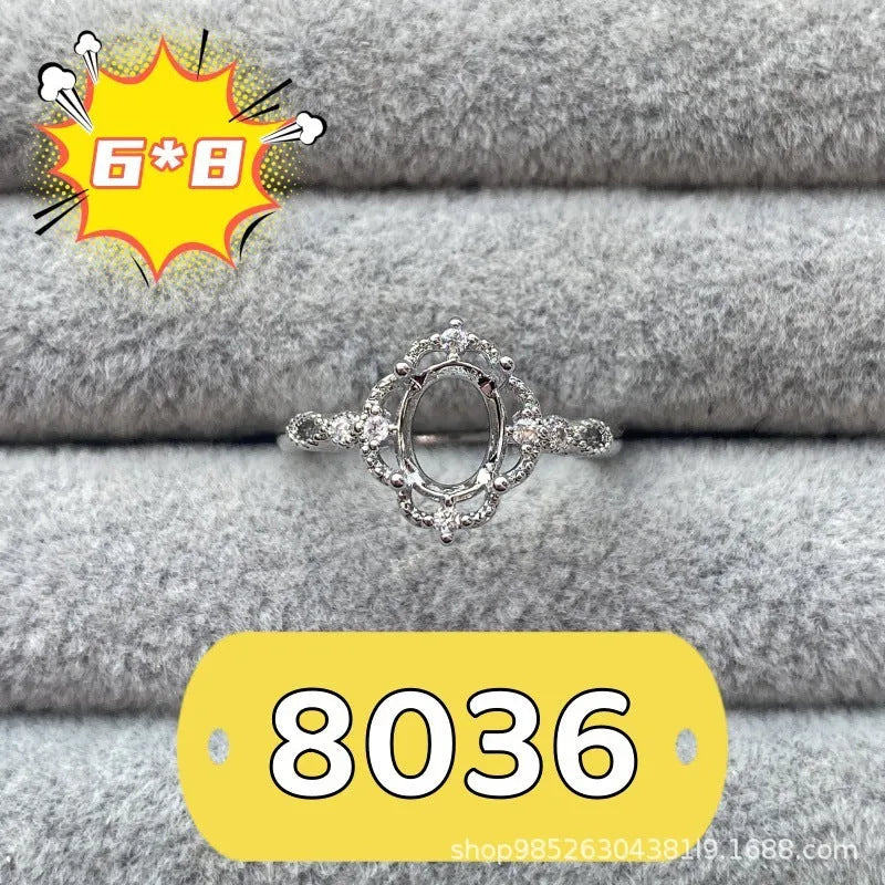Oval denier open mouth ring with 6x8 main stone and five-pointed star design