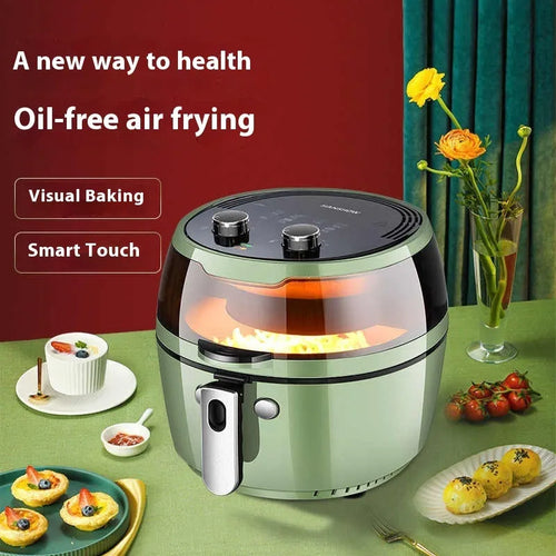 Silver mechanical button air fryer with transparent lid showing 8-litre nano-ceramic cooking basket inside.