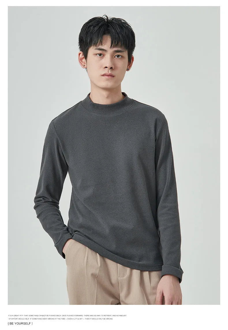 Men's brown Dralon fabric long sleeve t-shirt with a half-high collar and pullover style.