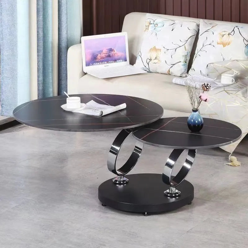 Round rotary folding table with slate top in black and white, set in a living room