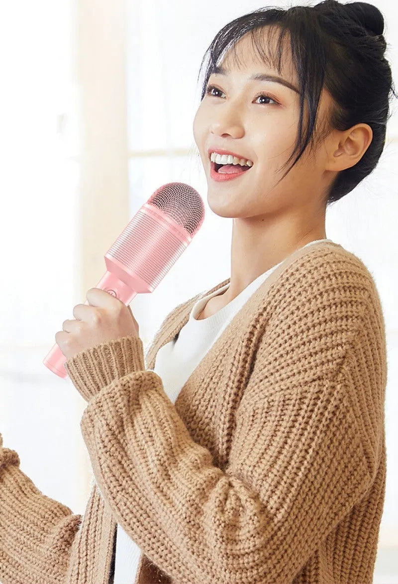 Wireless Bluetooth karaoke microphone in pink, blue, or green colour options with USB connection.