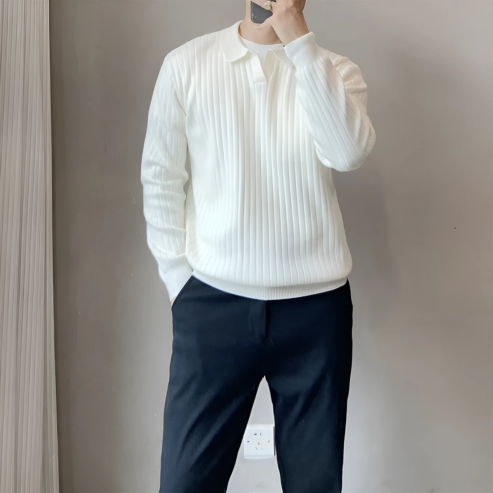 Man wearing a loose grey modal knit pullover sweater with a textured rabbit fur blend fabric.