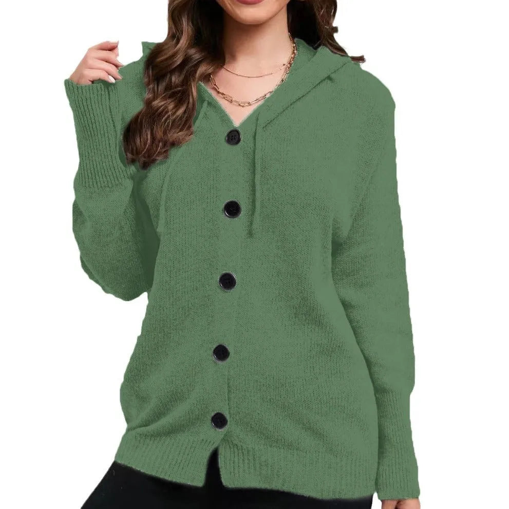 Women's loose-fit hooded cardigan in thick coloured cotton, shown in a solid colour with long sleeves.