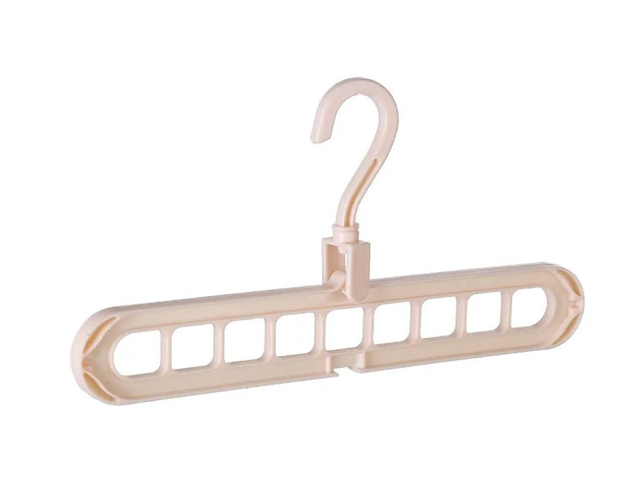 Plastic clothes hanger with rotating hook in pink colour, shown next to a green hanger.
