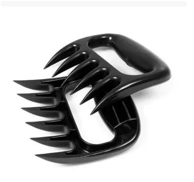 Two black bear claw meat shredder forks for pulling pork and BBQ preparation.