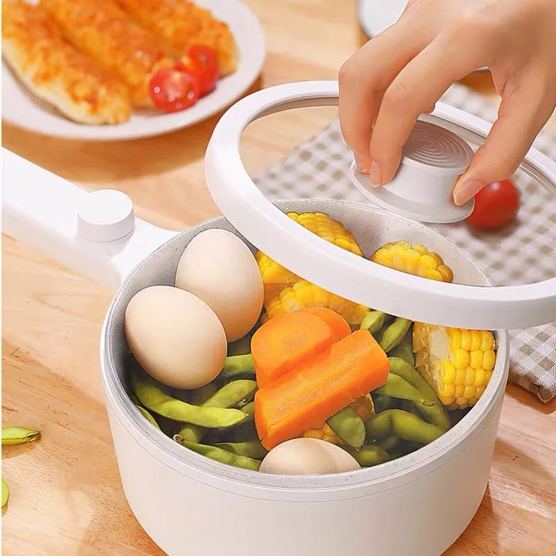 White and green portable electric cooking pot with multi-function controls and international plug