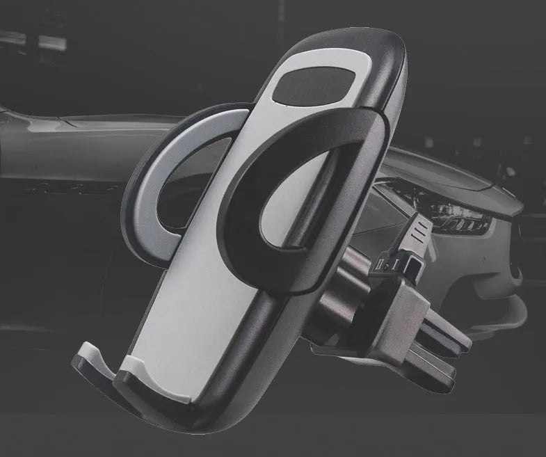 Black universal mobile phone holder clipped to car air conditioning outlet