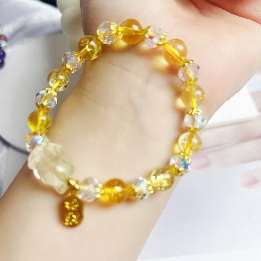Women's crystal bracelet with a detailed nine-tail fox charm in natural citrine.