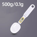 Black digital measuring spoon scale showing 0.0g display on LCD screen with 500g capacity