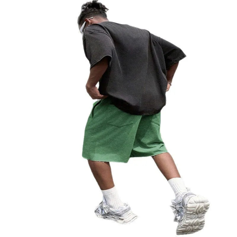 Men's black straight-leg hip-hop trousers in a medium length, laid flat.