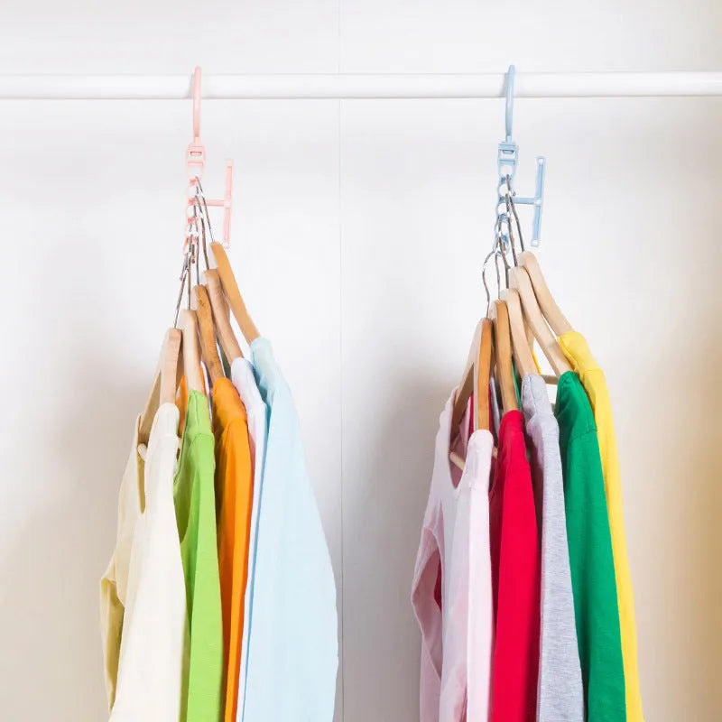 Blue revolving wardrobe hanger with five plastic branches and central handle for clothes organisation