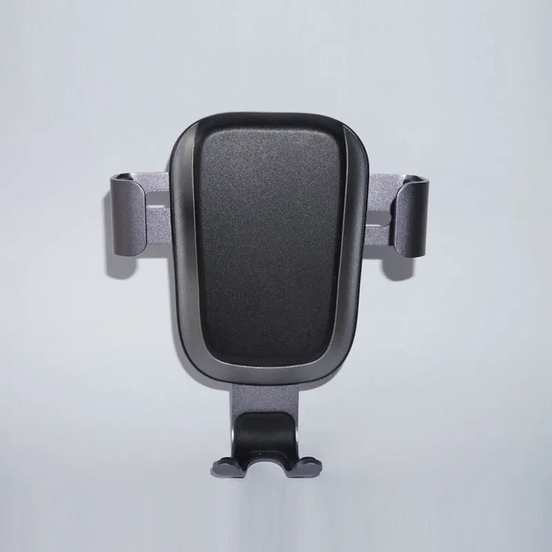 Black wireless car phone charger plugged into car dashboard with phone on charging pad, USB C port visible