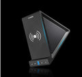 Black multifunctional Bluetooth speaker with integrated phone stand and wireless charging pad on top.