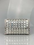 Silver rhinestone chain clutch purse with a horizontal square shape and open pocket.