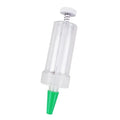 A white plastic mini garden seeder tool, 12cm long, for planting seeds in pots and trays.