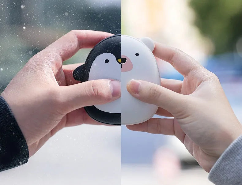 Cartoon penguin and polar bear design USB rechargeable hand warmer showing front and back.