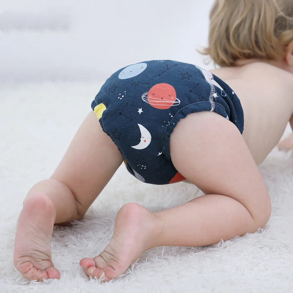 Baby training learning pants in cotton gauze with TPU waterproof layer, shown in panda print on white background