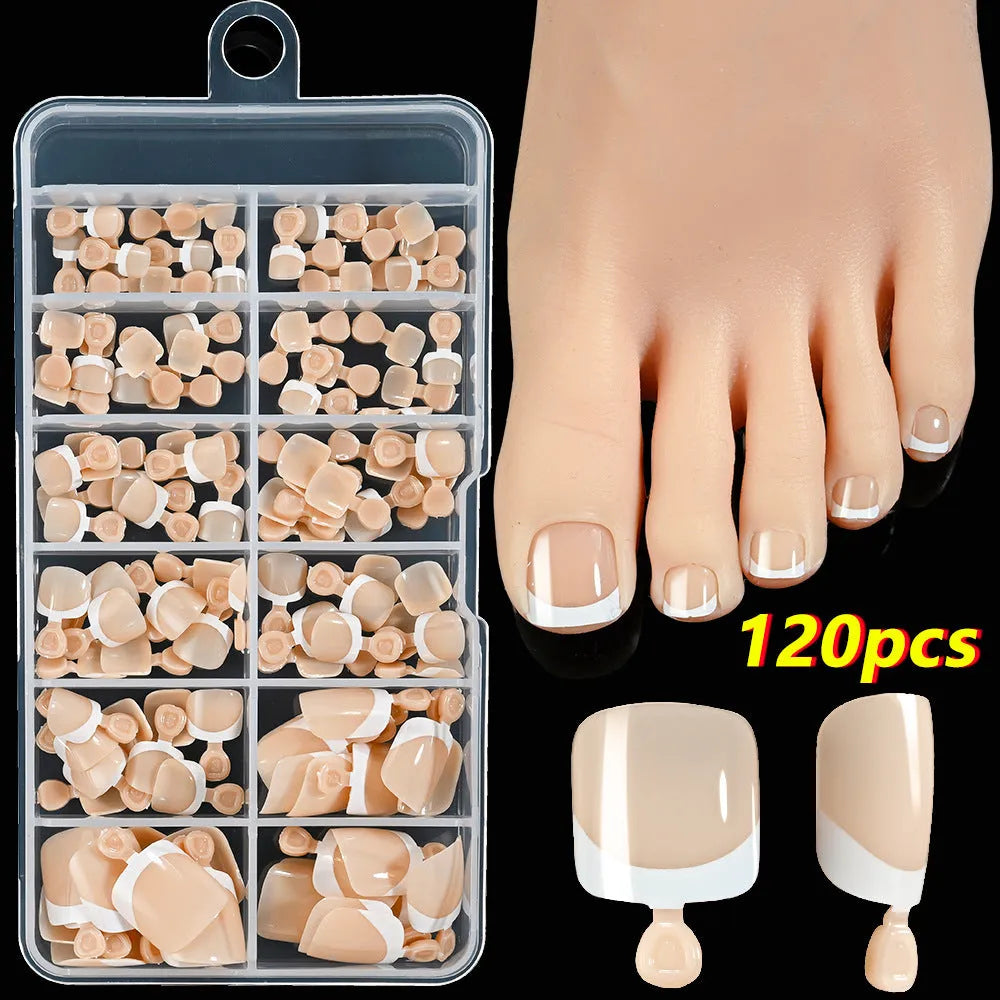 120 piece boxed set of full square short artificial toenails with French white edge design on nude base