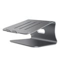 Silver aluminium laptop cooling bracket with striped texture on a wooden desk, rotated at an angle.