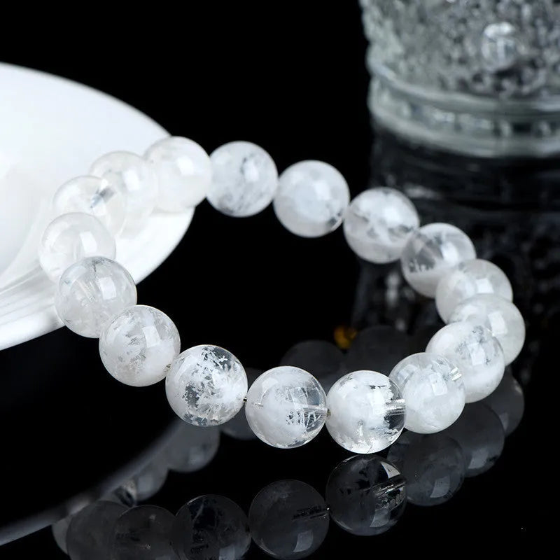 Women's crystal bracelet with round blizzard snowflake pattern beads, showing geometric and traditional design.