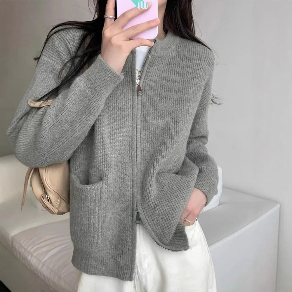 Soft beige viscose fibre sweater coat, a long-sleeve cardigan laid flat.