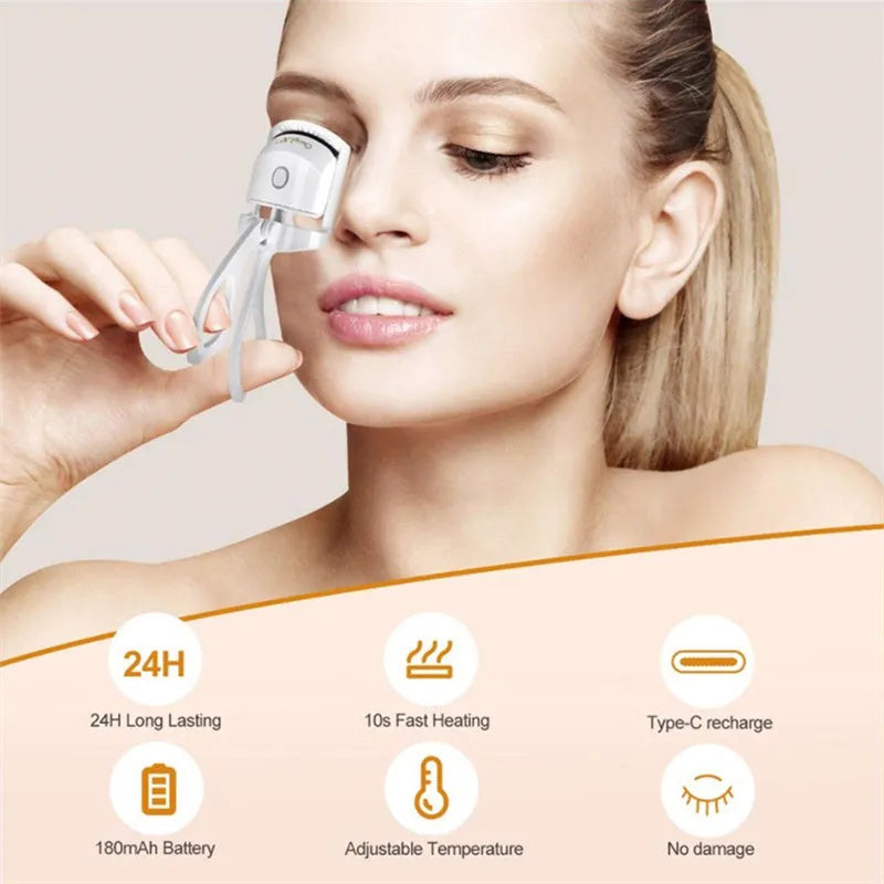 White USB rechargeable heated eyelash curler with a curved design and a small LED light.