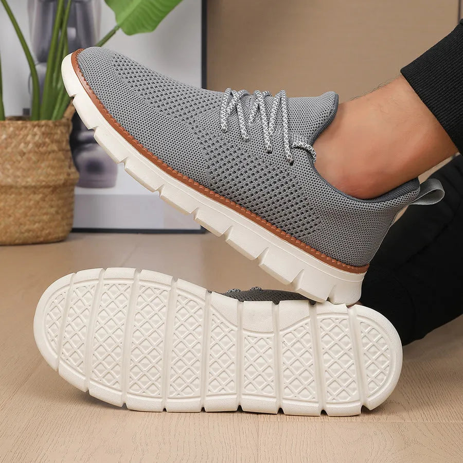 Men's grey and black mesh fabric casual sneakers with low heel and round toe.