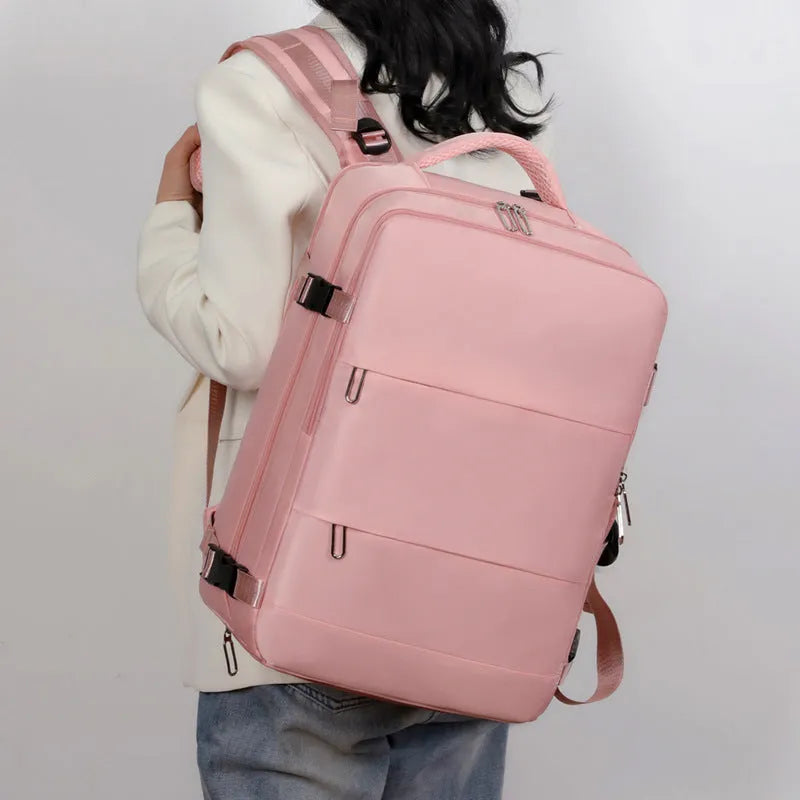 Large purple waterproof Oxford cloth travel backpack showing organisational pockets and air pillow belt