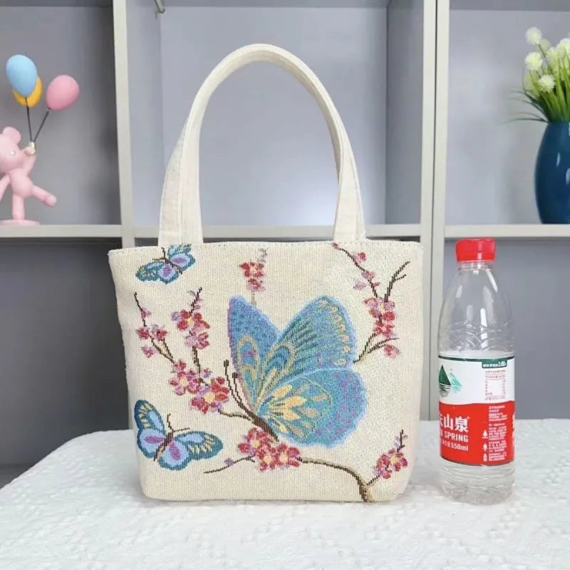 Double-sided gold wire embroidered canvas handbag in small, medium, and large sizes with patterned options.