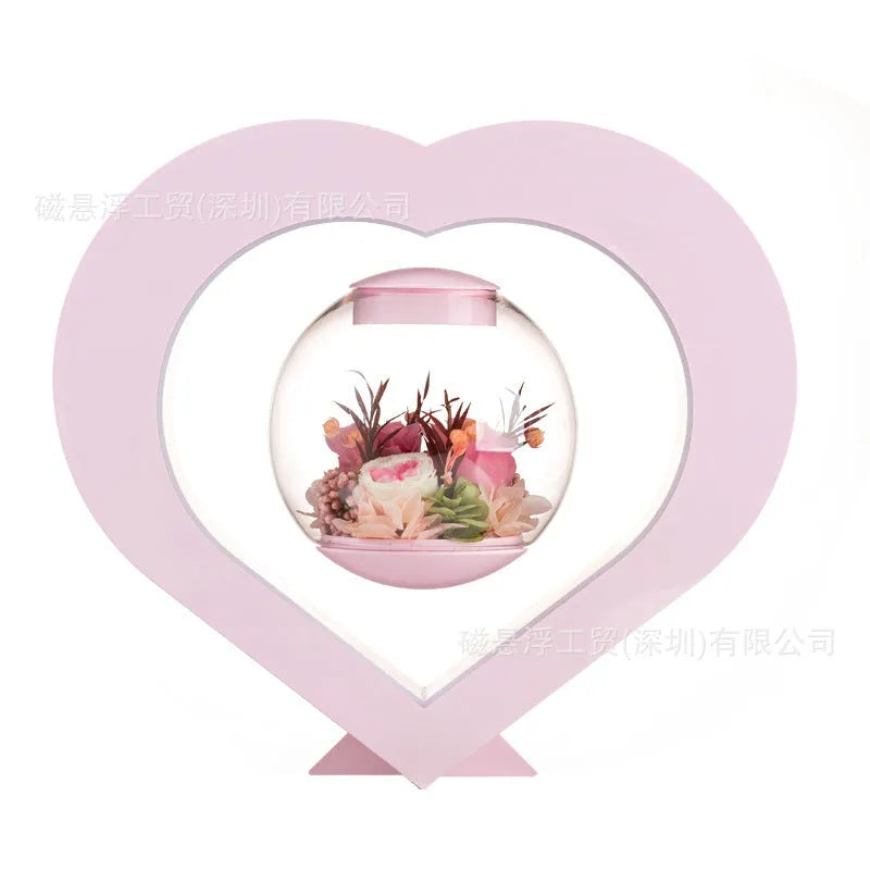 Pink preserved rose ornament in a decorative style, shown with optional base and bluetooth speaker features.