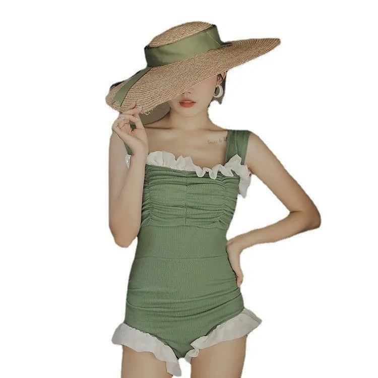 Korean-style high-waist one-piece swimsuit in black, pink, or green on a model