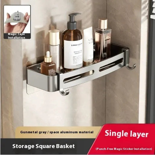Gun Gray metal corner storage rack mounted on a bathroom wall, holding toiletries.